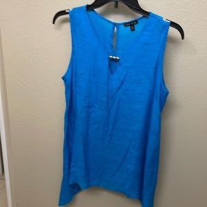 Beautiful blue sleeveless shirt with silver bead accent